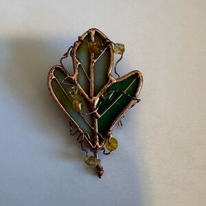 Vintage Stone and metal green leaf vine pin.